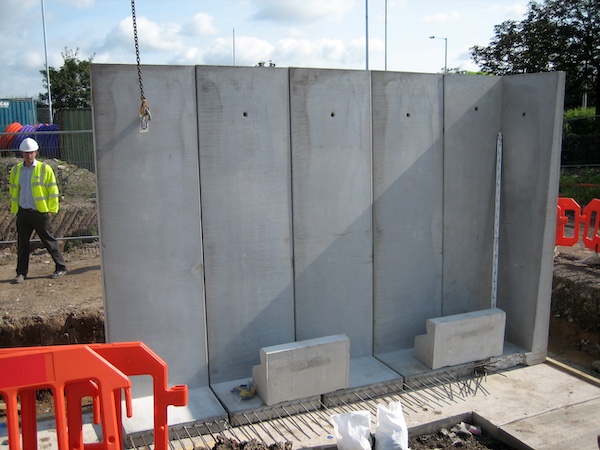 Installation of precast concrete units to create a dual level site